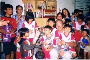 Ken with the orphans. It was our first Christmas with the orphans in 1999.