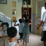 Singaporeans play with the orphans at the Truyen Tin Orphanage in Vietnam