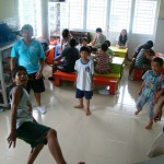 Singaporeans play with the orphans at the Truyen Tin Orphanage in Vietnam