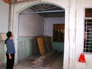 Here Miss Cu is showing the old balcony which will be a playground for the little ones.