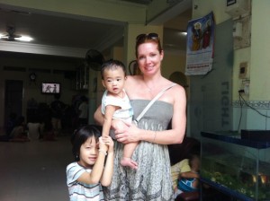 Amy with baby Thanh and Trung.
