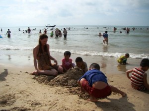 Fiona and the kids, building a sand castle.