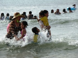 Volunteers and the kids enjoy the water.