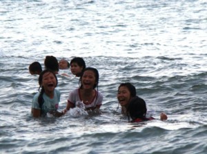 The girls enjoying fun in the sea. Every year they get bolder in the sea.